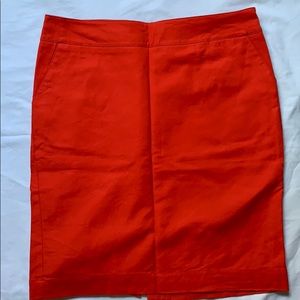Orange, pencil skirt.